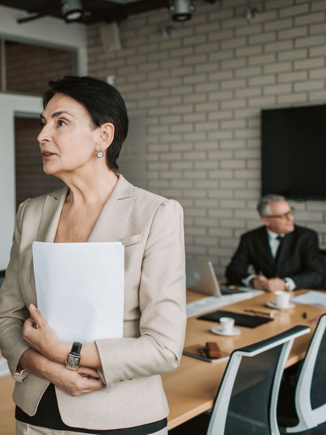 Two professionals in conversation during a business meeting