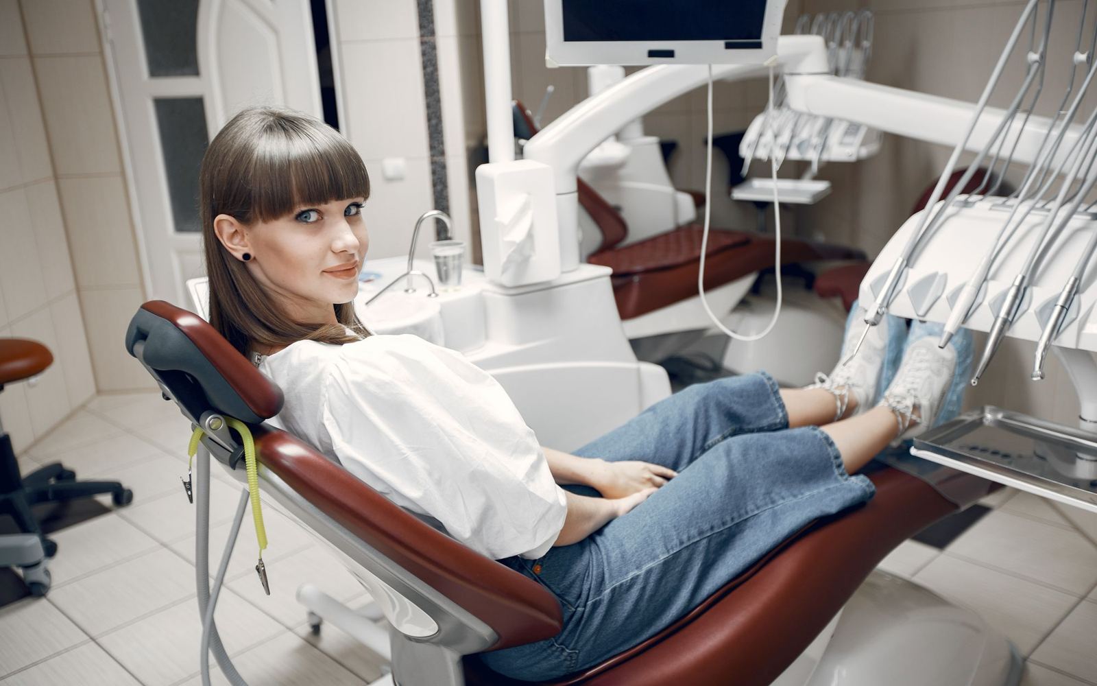 A patient seated comfortably in a modern dental chair