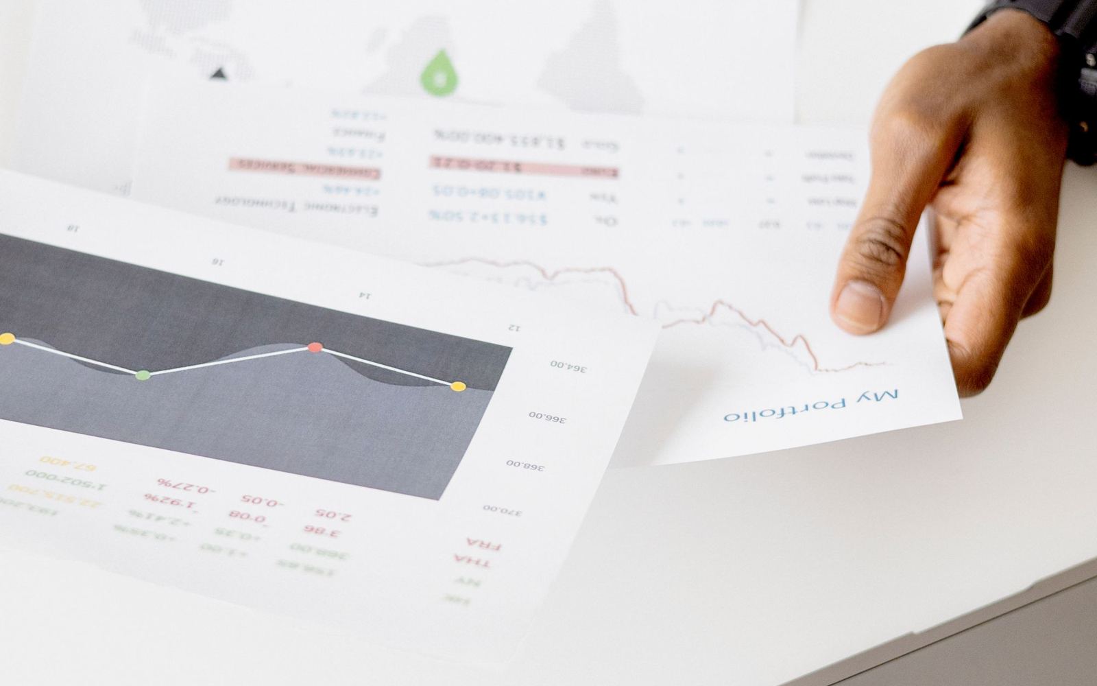 A business owner reviewing performance charts on a laptop
