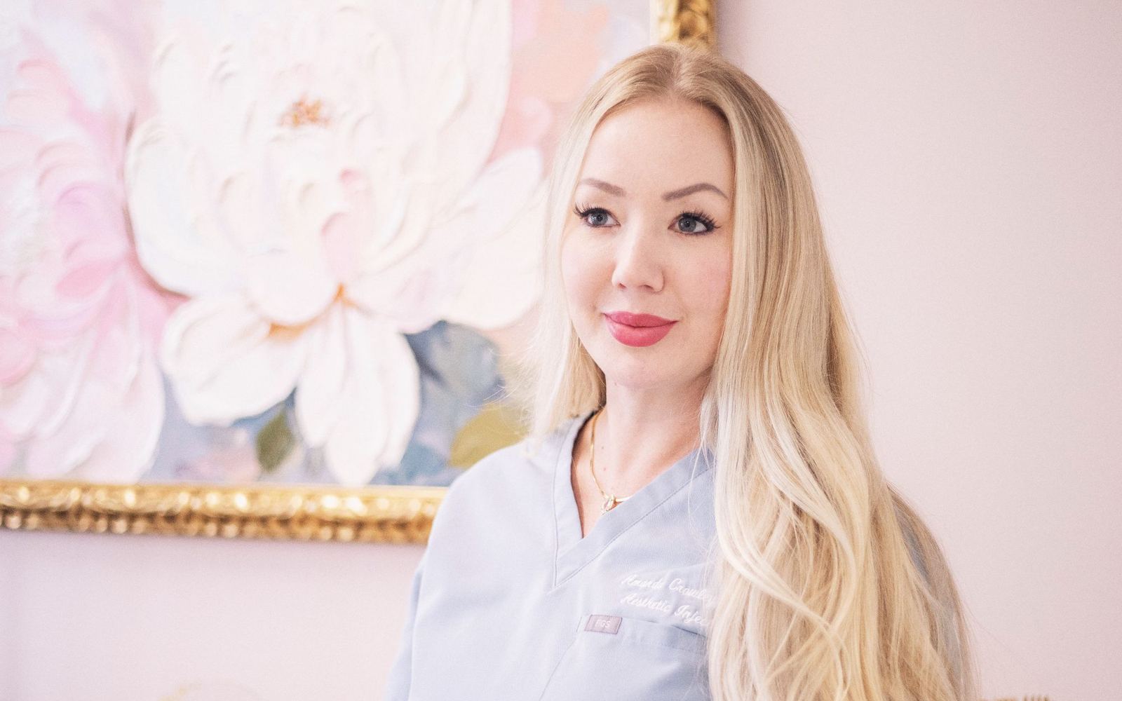 An aesthetic nurse in a softly decorated clinic