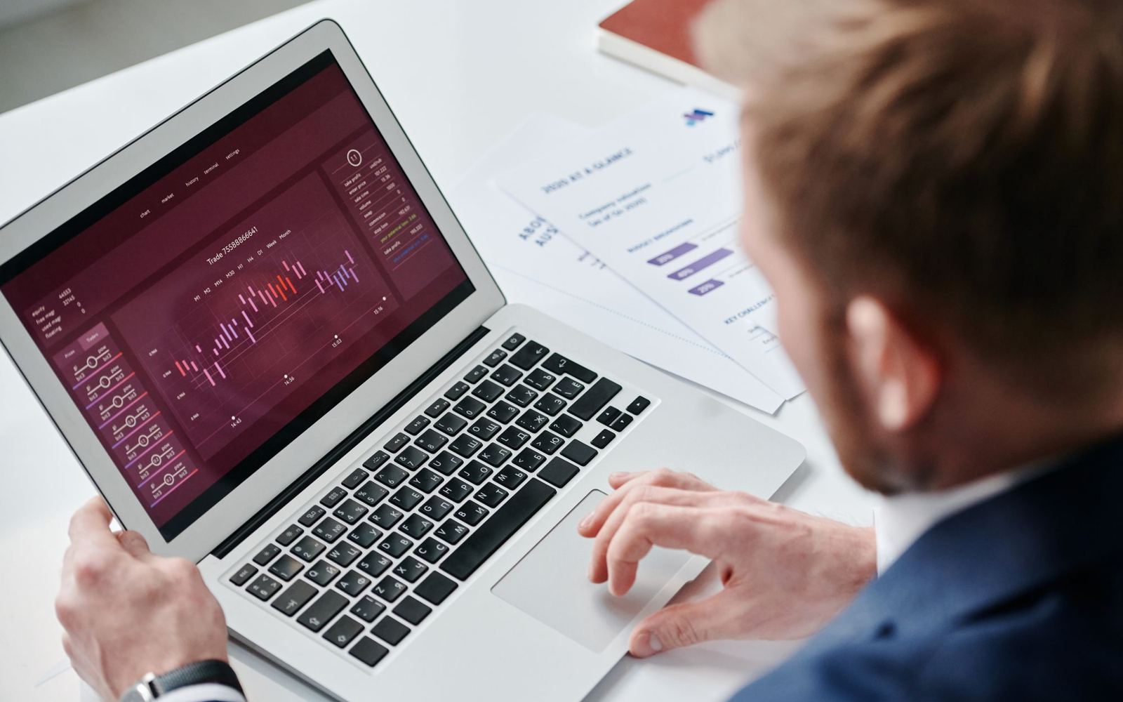 A business owner reviewing a dashboard on a laptop